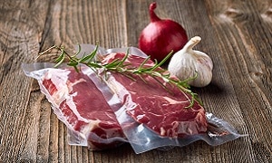 Vacuum sealed fresh beef steak in plastic bags for sous vide cooking